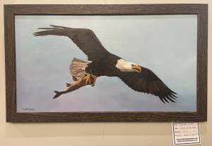 Charlotte Yealey painting: a flying bald eagle carrying a fish