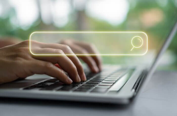 Close Up Of Hands Searching On Computer