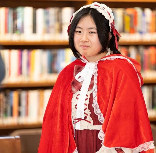Teen Girl Walking Fashion Show As Little Red Riding Hood