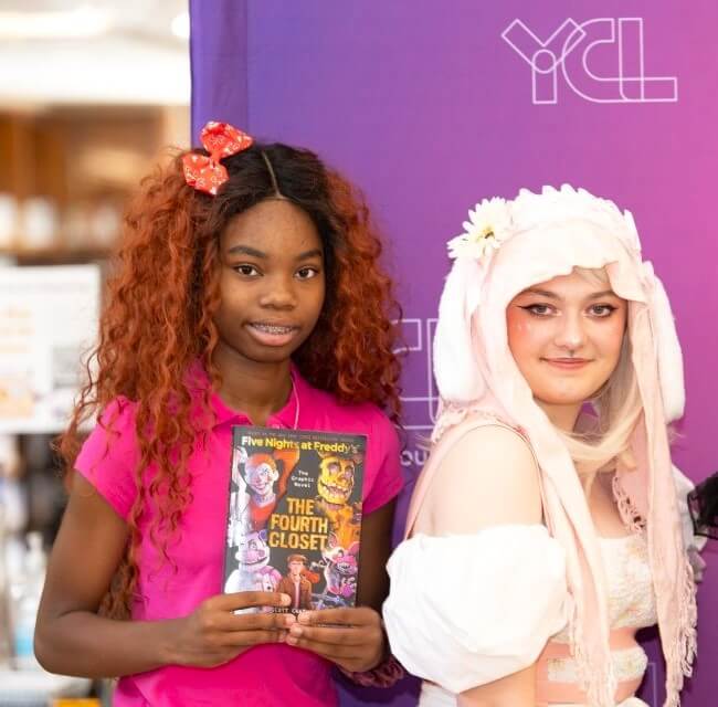 Two Teen Girls Dressed In Cosplay