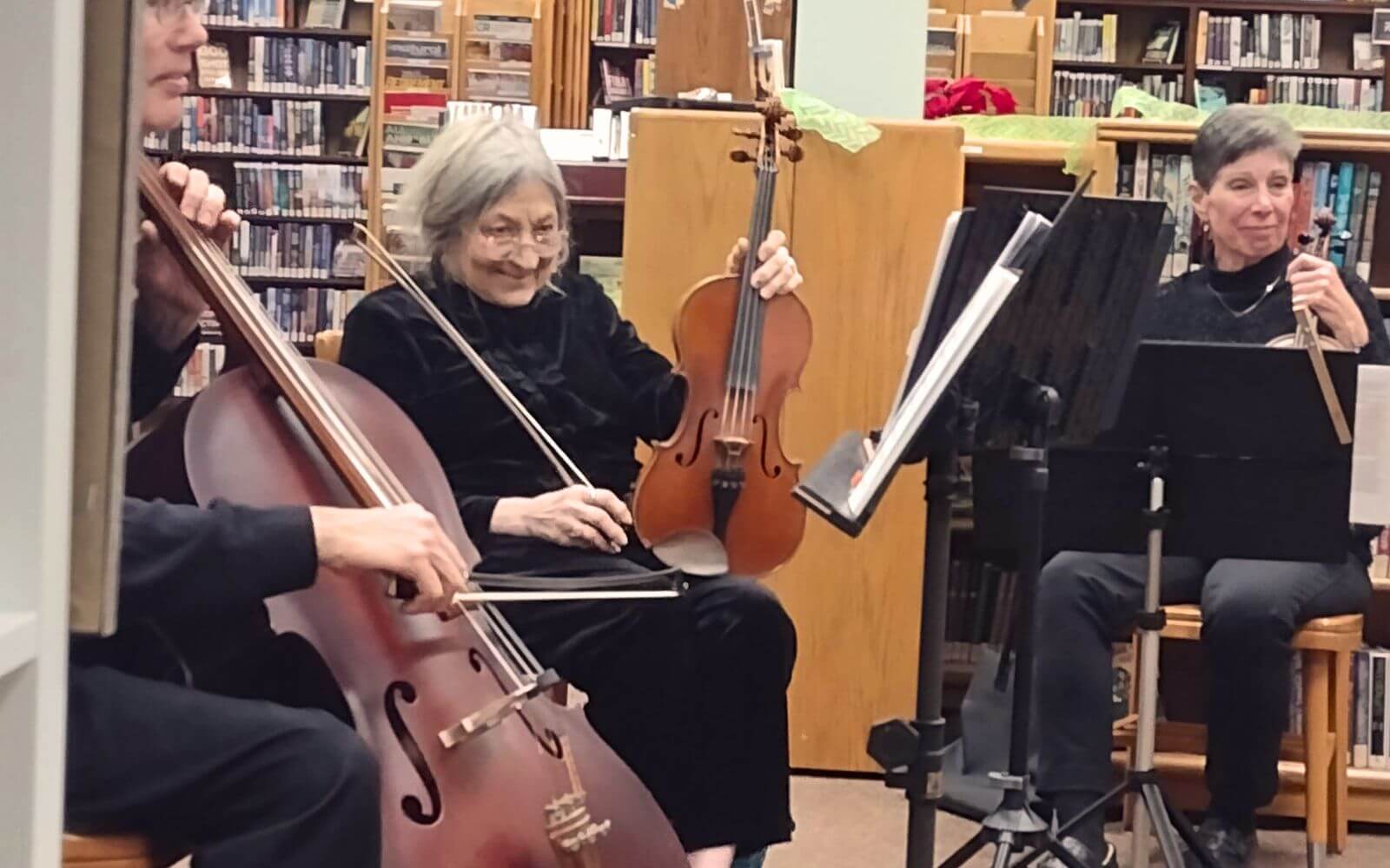Members of a string quartet enhance a story time at Hufnagel library of glen rock