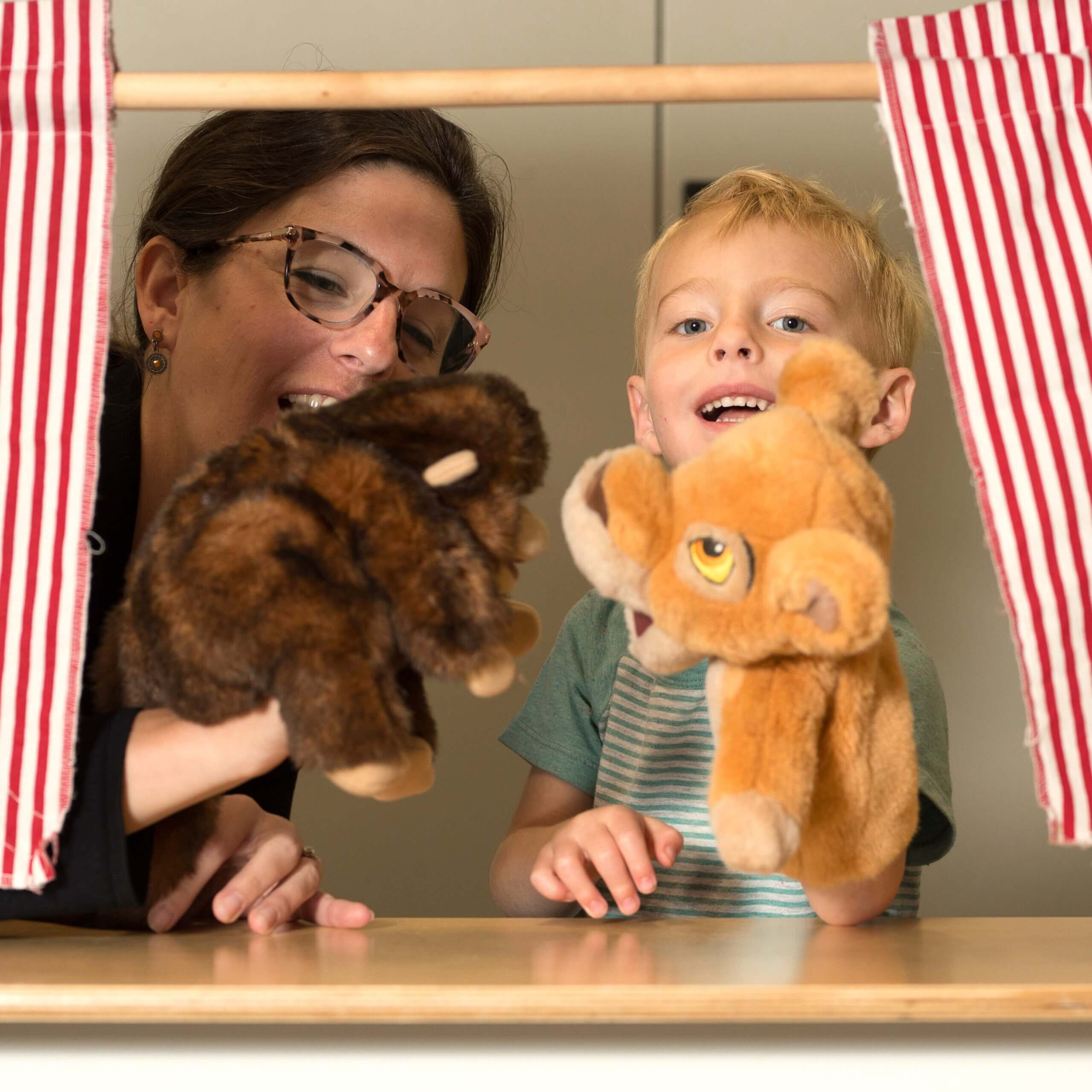 Mother And Son Playing Puppet Show