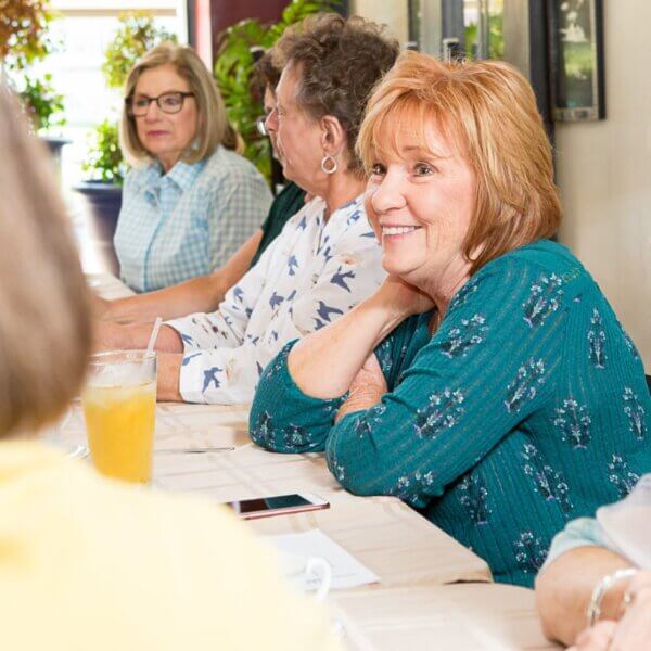 Woman And Friends Enjoying A Discussion