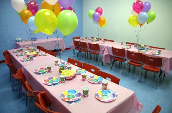 Two large tables arranged for a children's birthday party