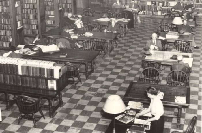 Black and white photo of Martin Library's Quiet Reading Room in the 1950s. It is an overhead view showing many people using the library.